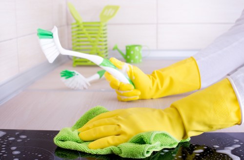 Reliable home cleaners in Wimbledon preparing a neat bedroom space